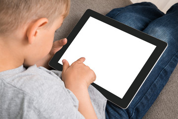 Cute Little Boy Using Digital Tablet