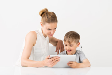 Mother And Son Using Digital Tablet