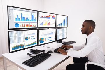 Businessman Analyzing Financial Chart On Computer