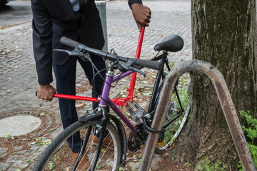Thief Trying To Break The Bicycle Lock