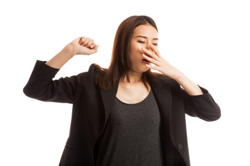 Sleepy young Asian woman yawn.