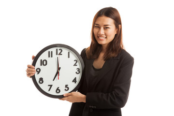 Young Asian business woman with a clock.