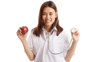 Young Asian female doctor hold  apple and stethoscope.