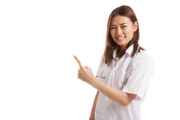 Asian young female doctor point to blank space.