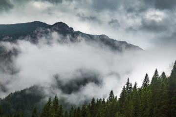 Storm clouds, and adter rain mist in the Romanian mountains, in summer