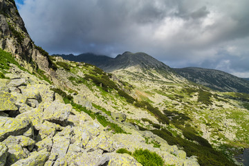 Mountain scenery in the Transylvanian Alps in summer, with mist clouds