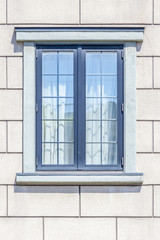 The modern window frame on white brick wall background.