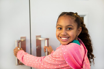 First day of school. Happy little girl going to school.