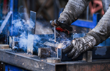 Arc welding of a steel in factory - obrazy, fototapety, plakaty