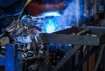 Arc welding of a steel in factory