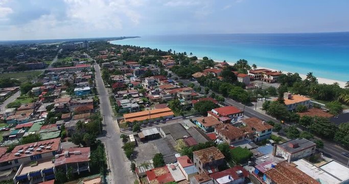 Bird's-eye view to main streets, houses and hotels of Varadero. Drone is flying over tropical island in the Atlantic Ocean.