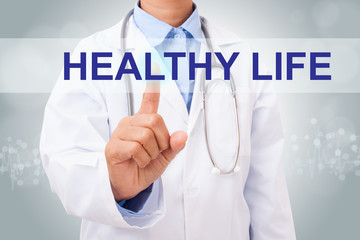 Doctor hand touching healthy life sign on virtual screen. healthy concept