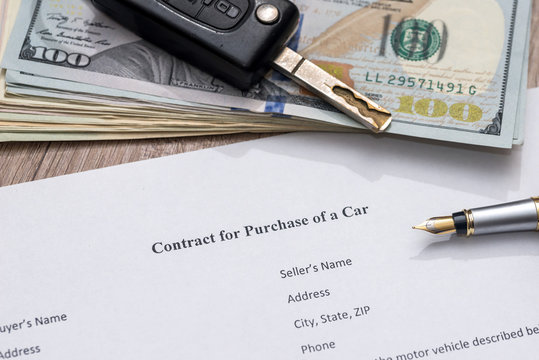 car contract form, pen and dollar