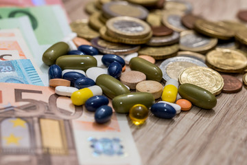euro banknote and coin with drug