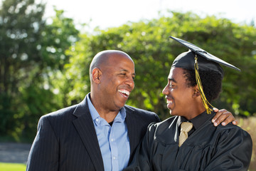 African American father and son at graduation.