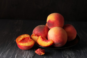 Fototapeta na wymiar Peaches on black