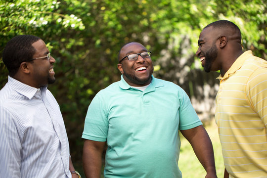 Brothers Hanging Out Talking And Laughing.