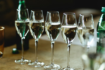 Champagne sparkles in the crystal glasses.