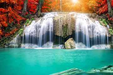 Fototapeta na wymiar Amazing waterfall in autumn forest 