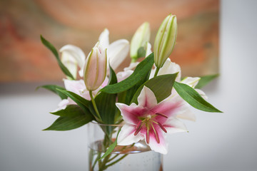 Fototapeta na wymiar lilies in a vase to decorate the kitchen table in the house