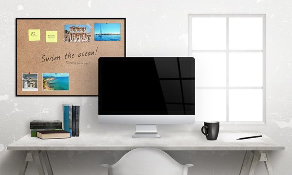 Computer display and cork bulletin board in background. Blank screen for mockup. Front view of office desk.