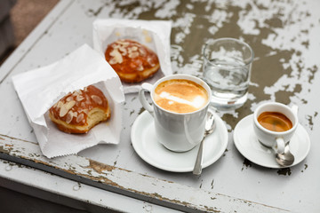 Coffee and donuts on vintage table