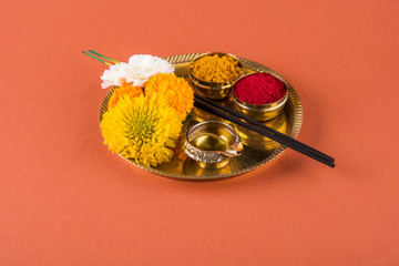Beautifully Decorated Pooja Thali for diwali celebration to worship, huldi or turmeric powder and...