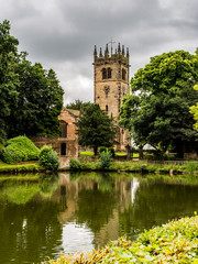 Gawesworth, Cheshire, UK. July 26th 2016. Attractive Gawesworth village church behind village pond at Gawesworthl, Cheshire, UK