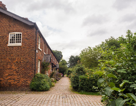 Styal, Cheshire, UK. July 26th 2016. Quintessential english cottages in Styal village on a cloudy summer day, Styal, Cheshire, UK