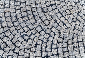 Grey cobblestone pavement background