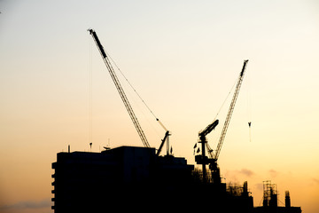 silhouette of construction building at sunset time
