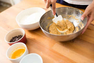 Mixing paste in bowl for making cookies