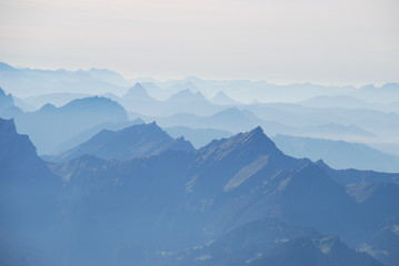 Fototapeta na wymiar Mist in the Swiss alps panoramic view
