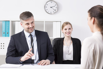 Businessman gesturing at woman