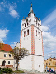 Fototapeta na wymiar White bell tower in the historical centre of Vimperk, Southern Bohemia, Czech Republic