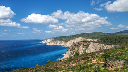 Naklejka na ściany i meble Zakynthos cliff panorama with clear water, blue sky and white cl