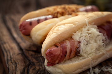 Hot dogs on wooden table with copy space