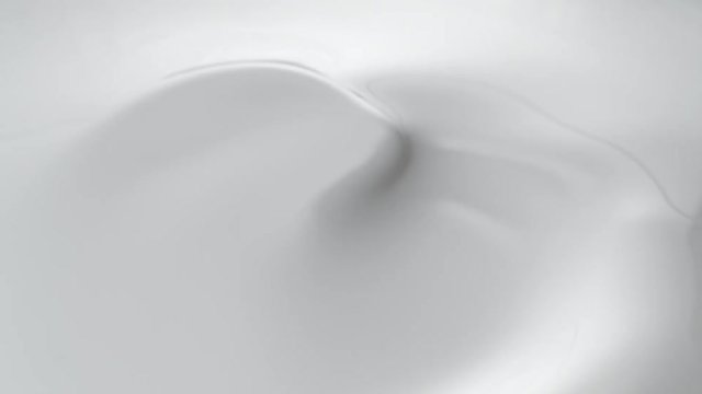 Swirl in milky liquid surface. Shot with high speed camera, phantom flex 4K. Slow Motion. 