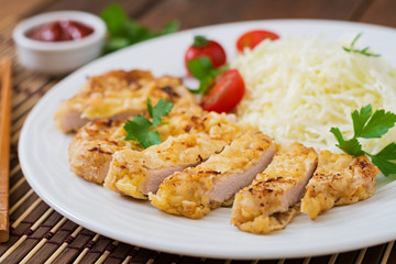 Fried pork cutlet with fresh cabbage salad and sauce