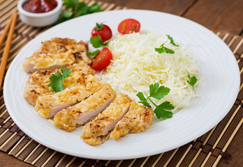 Fried pork cutlet with fresh cabbage salad and sauce
