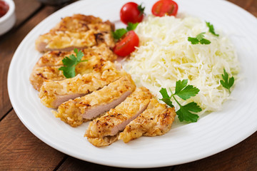 Fried pork cutlet with fresh cabbage salad and sauce