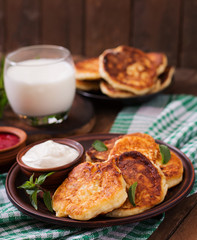 Cheesecakes with mint and sour cream. Breakfast.