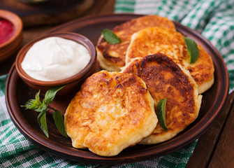 Cheesecakes with mint and sour cream. Breakfast.