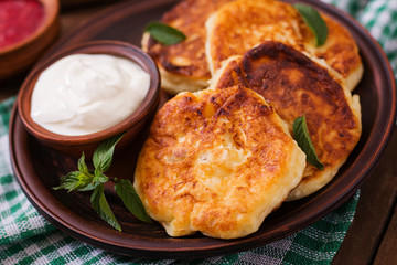 Cheesecakes with mint and sour cream. Breakfast.
