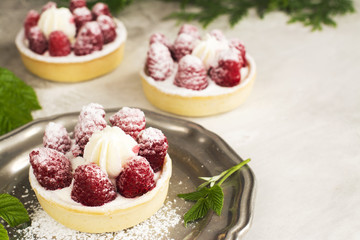 Sweet small tarts with fresh raspberry