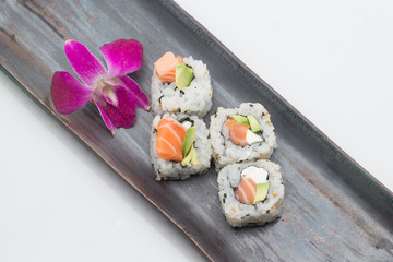 salmon avocado roll with cream cheese on dish