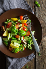 Fresh vegetable salad in rustic style