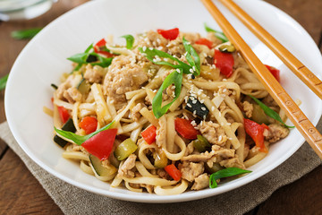 Udon noodles with meat and vegetables in an Asian style