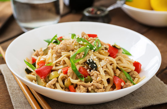 Udon noodles with meat and vegetables in an Asian style