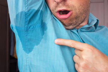 Sweaty spot on the shirt because of the heat, worries and diffid